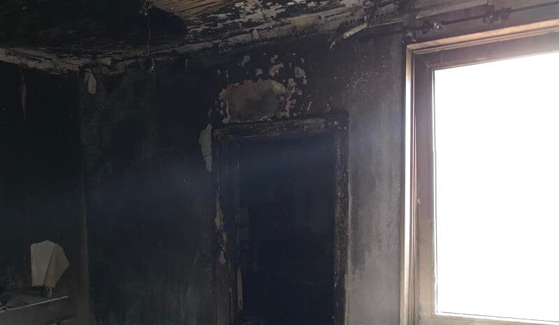 Fire damaged doorway in property