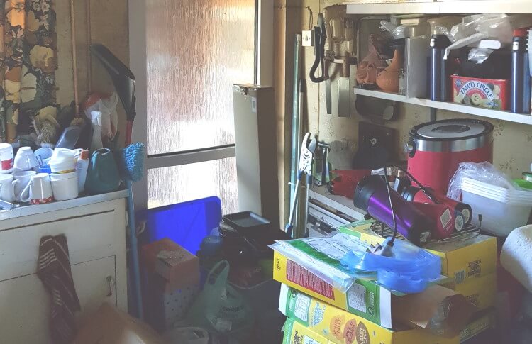 Selling hoarder's house with messy kitchen