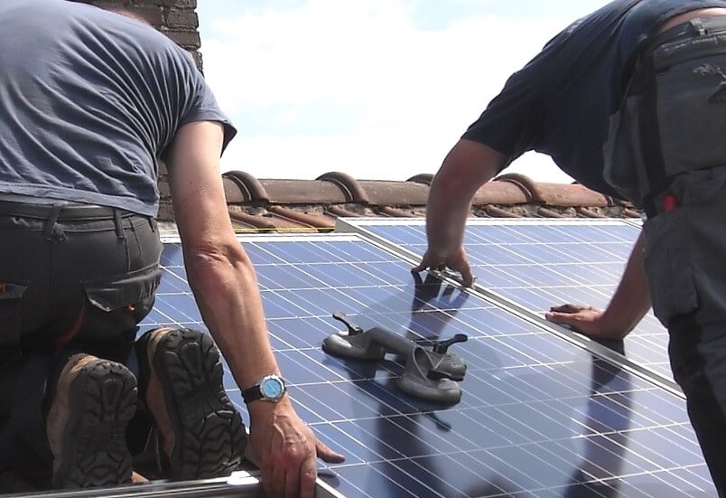 Solar panels being fitted on house